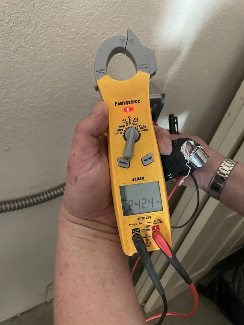 Voltage testing with clamp meter during Ceiling Fan Installation in Bloomington